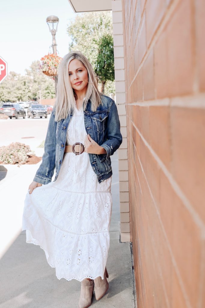 Denim Outfits by popular Nashville fashion blog, Nashville Wifestyles: image of a woman wearing a white dress and denim jacket. 