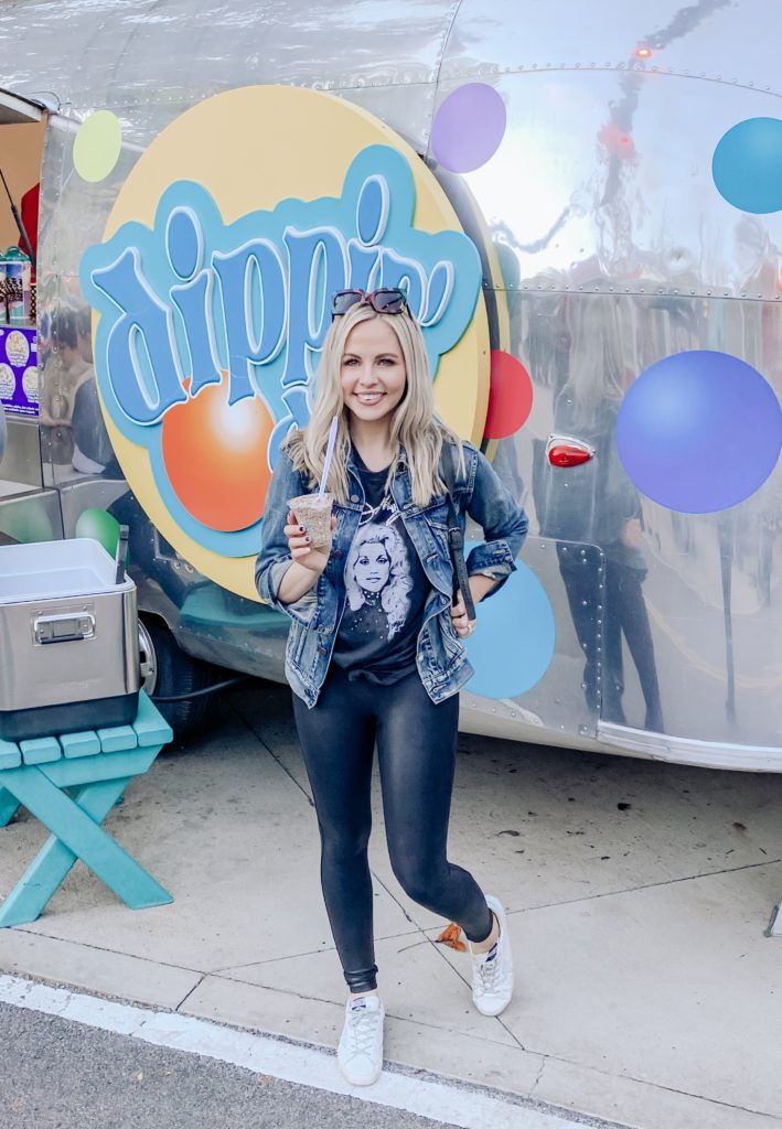 Pigeon Forge TN by popular Nashville travel blog, Nashville Wifestyles: image of a woman standing in front of a Dippin' Dots. 