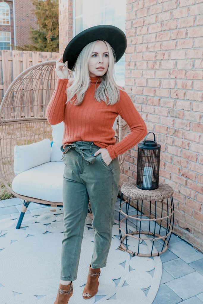 Stylish Weekend Outfit Ideas by popular Nashville mom fashion blog, Nashville Wifestyles: image of a woman wearing a orange ribbed turtleneck sweater, green paper bag pants, peep toe shoes, and a Amazon Lack of Color Women's Melodic Wide-Brimmed Wool Fedora.