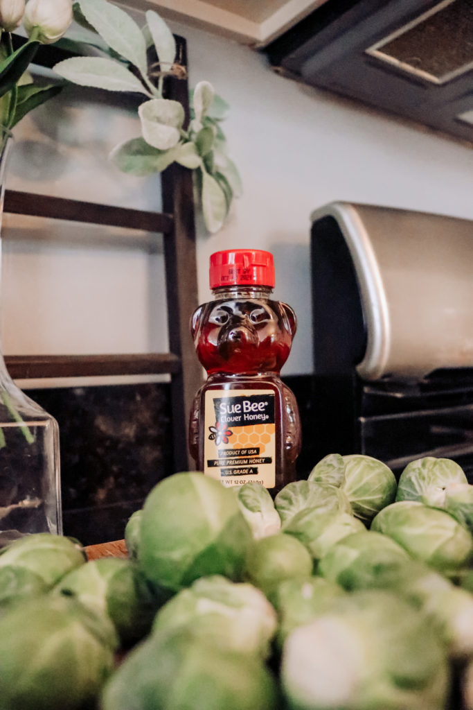 Honey Roasted Brussel Sprouts by popular Nashville life and style blog, Nashville Wifestyles: image of Brussel sprouts and a Sue Bee honey bear.