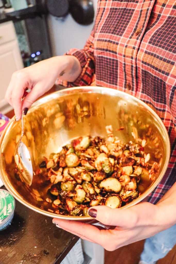 Honey Roasted Brussel Sprouts by popular Nashville life and style blog, Nashville Wifestyles: image of honey roasted Brussel sprouts in a metal bowl. 