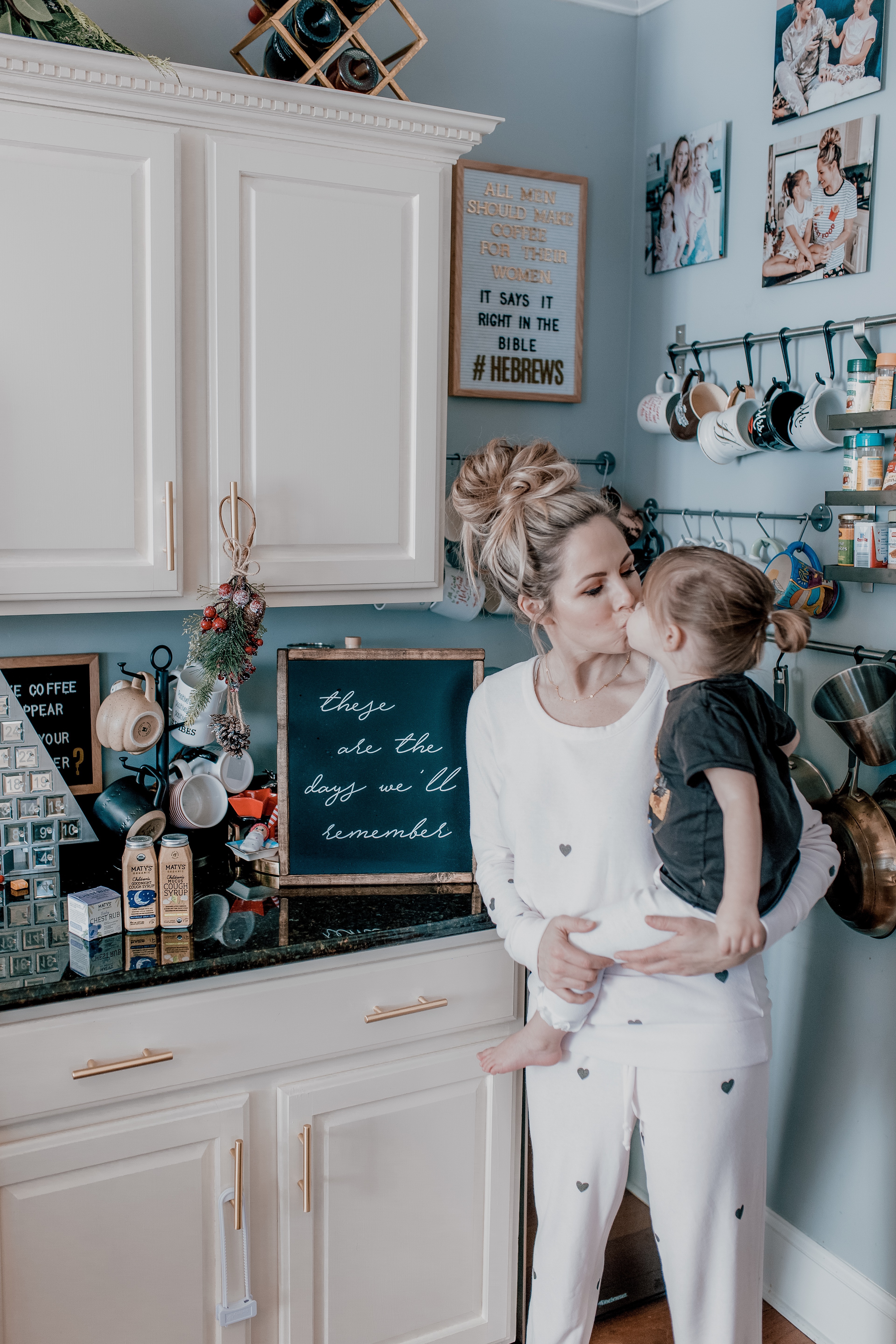 Immune Boosting Recipes by popular Nashville lifestyle blog, Nashville Wifestyles: image of a mom holding her toddler age daughter and kissing her on the lips. 