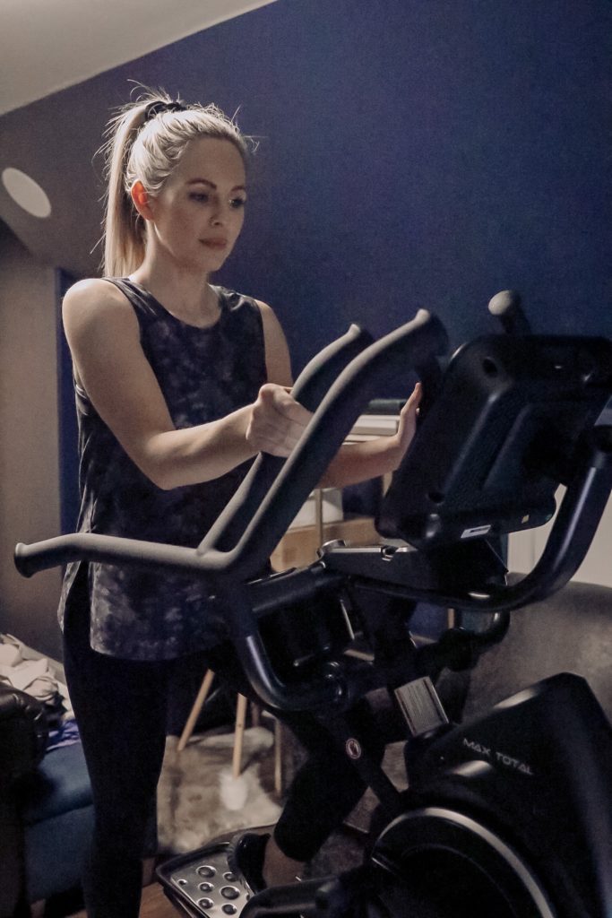 Bowflex Max Trainer by popular Nashville lifestyle blog, Nashville Wifestyles: image of a woman on a Bowflex Max Trainer. 
