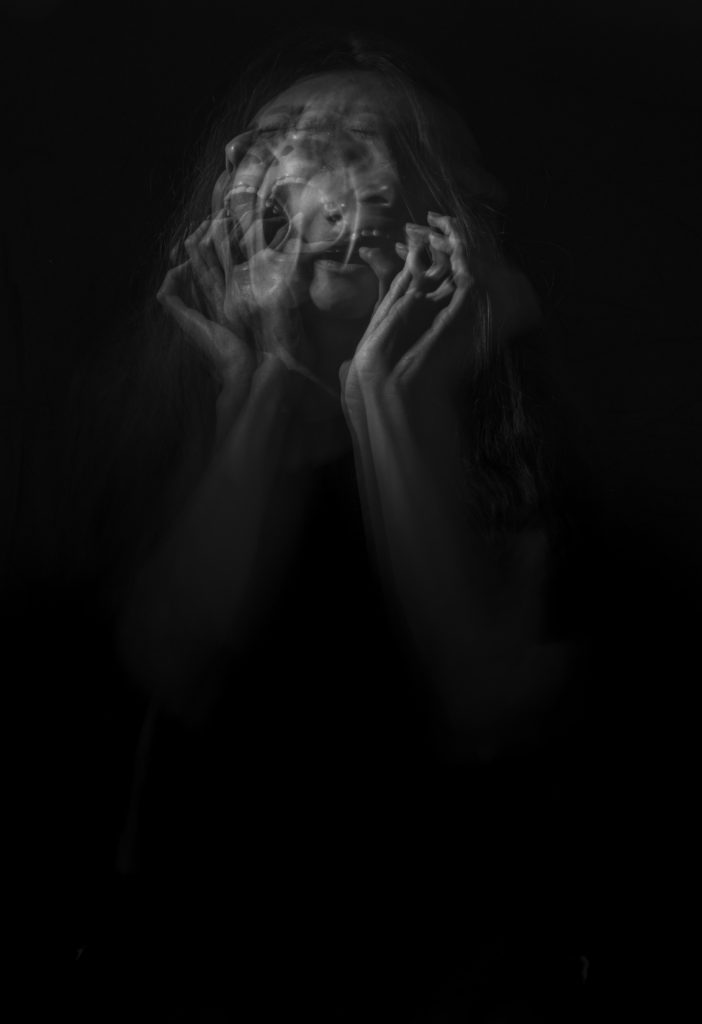 How to Cope With Grief by popular Nashville lifestyle blog, Nashville Wifestyles: black and white image of a woman screaming. 