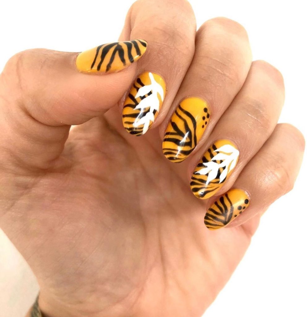 Bright Summer Nails by popular Nashville beauty blog, Nashville Wifestyles: image of animal print nails. 
