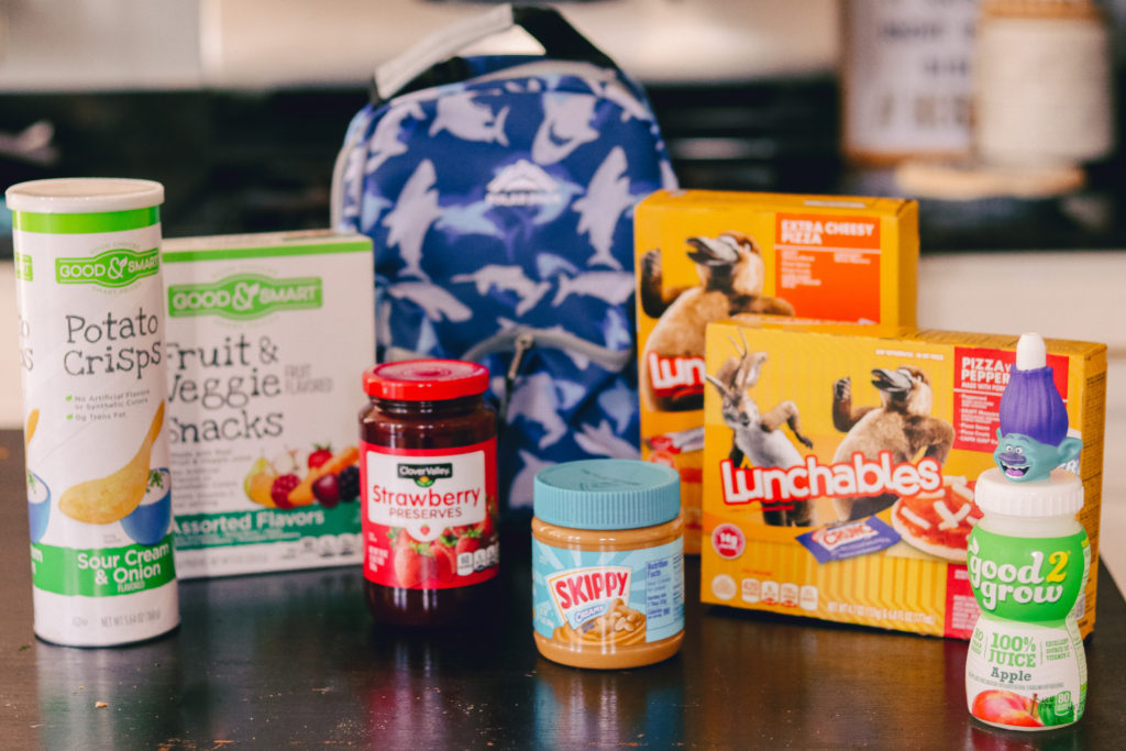 Back to School Tips by popular Nashville lifestyle blog, Nashville Wifestyles: image of Good and Smart potato crisps, Good and Smart fruit and veggie snacks, Good and Smart strawberry jam, Skippy peanut butter, lunchables, and good 2 grow juice bottle. 