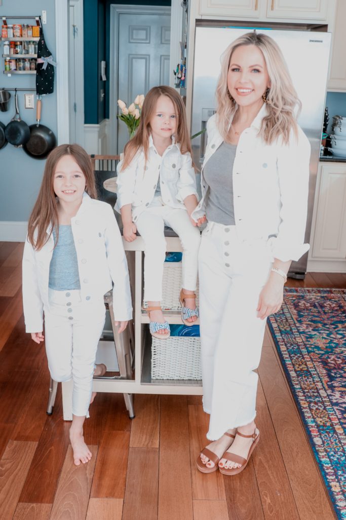 Wearing White by popular Nashville fashion blog, Nashville Wifestyles: image of a mom and her two daughters wearing matching white denim jackets and white denim jeans. 