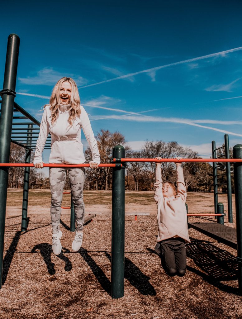 Things to do in the Summer by popular Nashville lifestyle blog, Nashville Wifestyles: image of a mom and her young daughter playing on the playground together. 