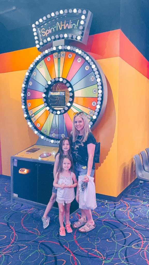 Pigeon Forge TN by popular Nashville travel blog, Nashville Wifestyles: image of a mom and her two daughters in front of a arcade game. 