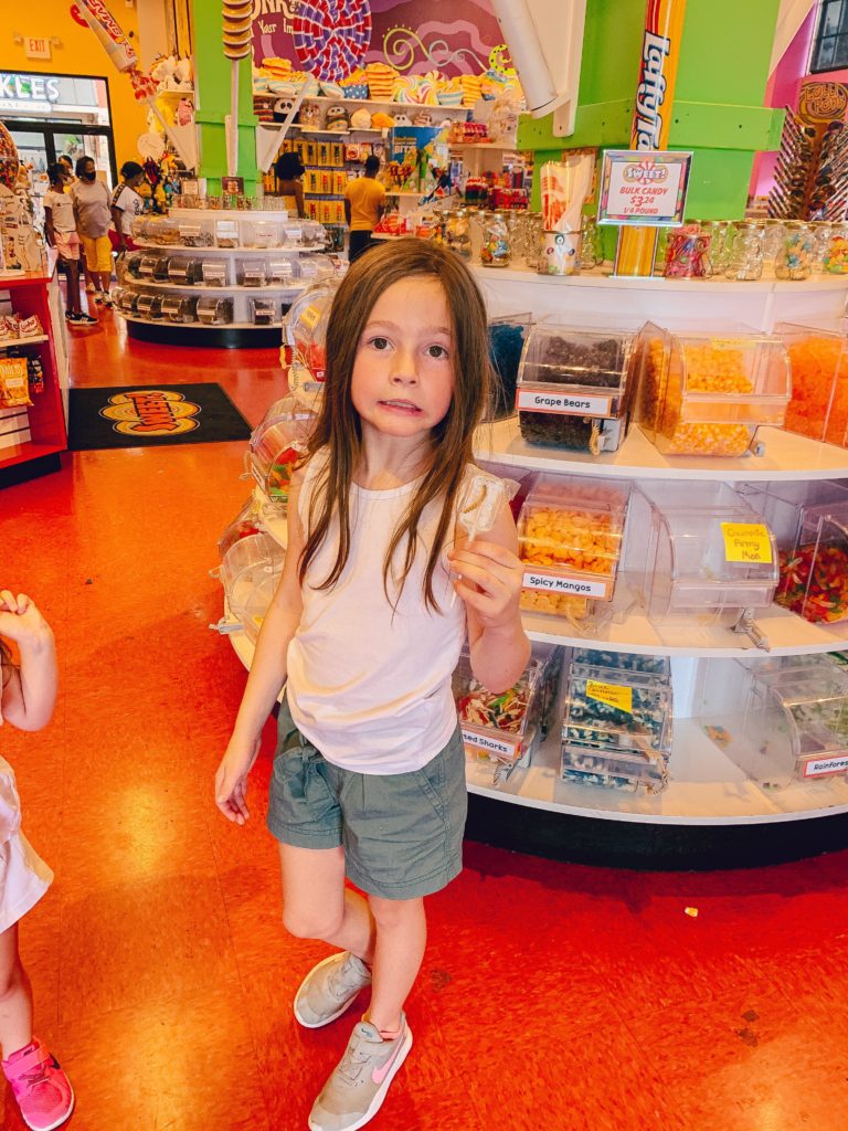 Pigeon Forge TN by popular Nashville travel blog, Nashville Wifestyles: image of a young girl in a candy shop. 