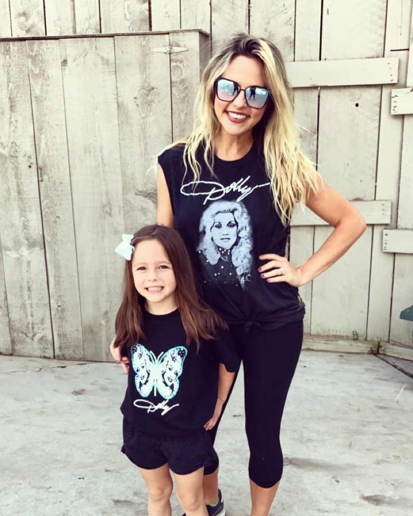 Pigeon Forge TN by popular Nashville travel blog, Nashville Wifestyles: image of a mom and her young daughter wearing Dolly Parton shirts. 