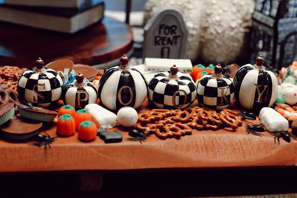 Halloween Snack Ideas by popular Nashville lifestyle blog, Nashville Wifestyles: image of a kitchen counter decorated with Mackenzie Childs Halloween decor and a Halloween dessert tray. 
