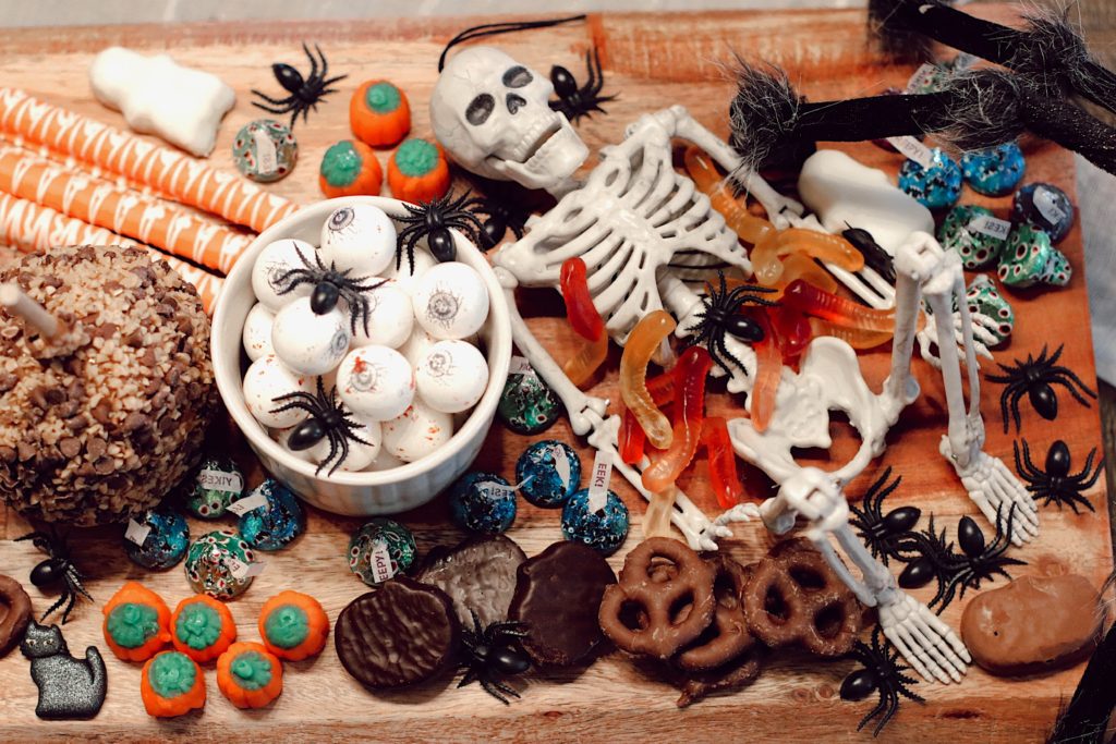 Halloween Snack Ideas by popular Nashville lifestyle blog, Nashville Wifestyles: image of a kitchen counter decorated with Mackenzie Childs Halloween decor and a Halloween dessert tray. 