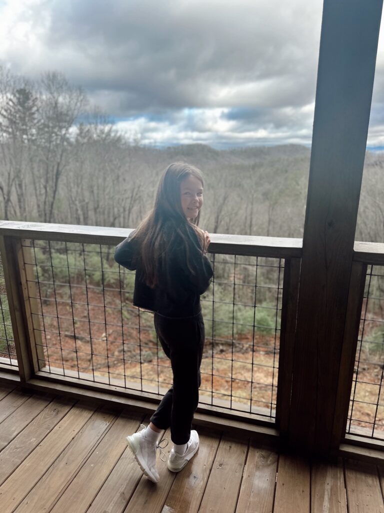 Exterior of cozy family-friendly Airbnb cabin near Blue Ridge GA with mountain views